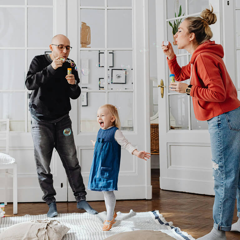 family-blowing-bubbles